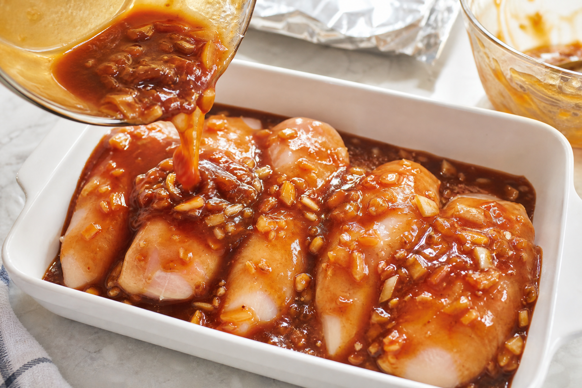 Stir four things into a bowl, pour it over the chicken, and let the oven turn it into glaze
