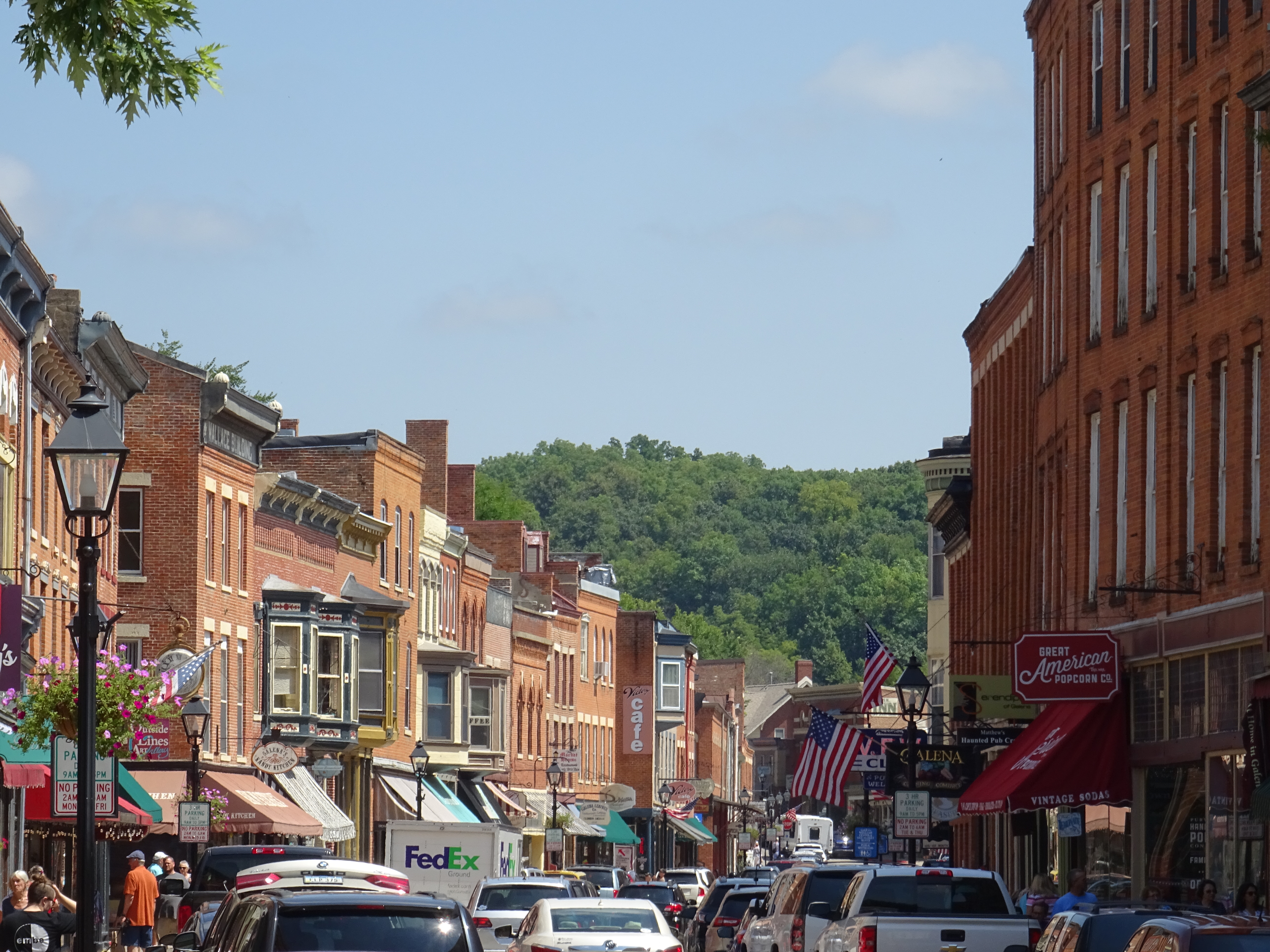 A second view down Galena's historic Main Street with brick buildings and hills in the distance